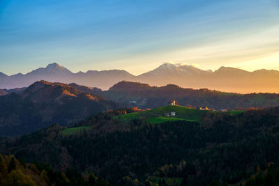 Scenic view of mountains against sky during sunset