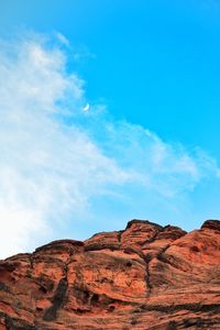 Scenic view of mountain against blue sky