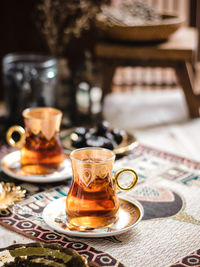 A glass of turkish tea on the table. conceptual stilllife photograhy with ramadan vibes concept