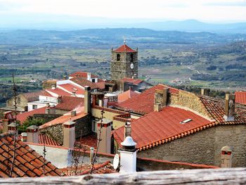 High angle view of townscape by city against sky