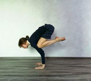 Full length of woman dancing on floor