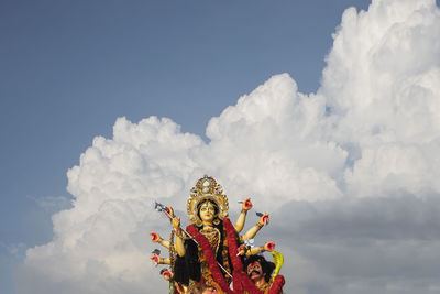 Low angle view of statue against sky