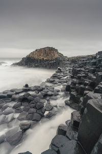 Panoramic view of sea and rocks against sky