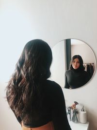 Portrait of woman standing in bathroom