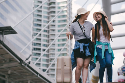 Tourists standing in city