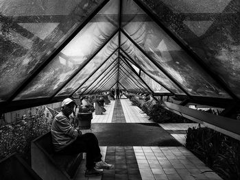 People sitting on bridge