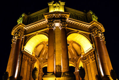 Low angle view of illuminated statue at night