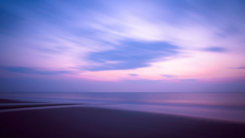 Scenic view of sea against sky at sunset