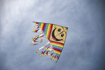 Low angle view of balloons flying against sky