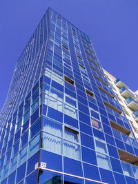 Low angle view of modern building against clear sky