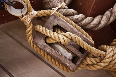 Close-up of ropes in wooden pulley