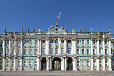 Facade of historic building against blue sky