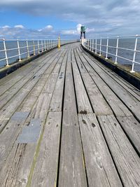 Pier over sea against sky