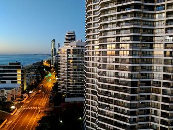 Modern buildings against sky in city