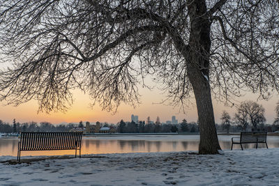 Scenic view of frozen lake against sky during sunset