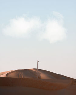 Low angle view pole in desert against sky