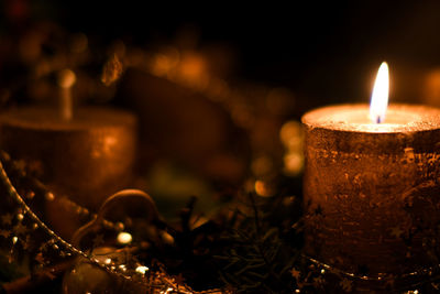 Close-up of illuminated tea light candle