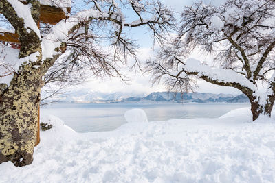 Beautiful scenery of lake tazawa of tazawako cover by snow in winter akita japan.