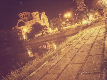 Low angle view of illuminated city at night