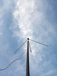 Low angle view of pole against blue sky
