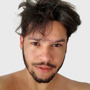 Portrait of shirtless man against white background