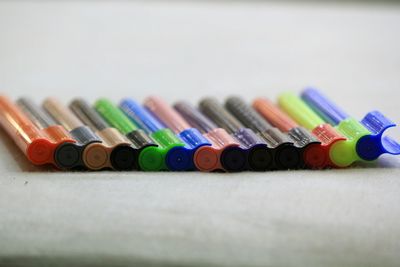 Close-up of colored pencils in row