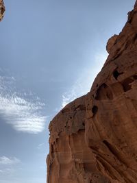 Low angle view of rock formations against sky