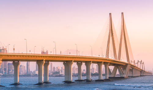 Bridge over river against clear sky in mumbai. the bandra worli sea link.