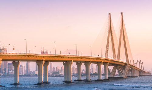 Bridge over river against clear sky in mumbai. the bandra worli sea link.