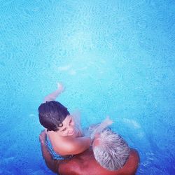 High angle view of woman swimming in pool