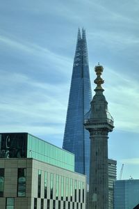 Low angle view of skyscrapers against sky