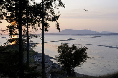 Scenic view of sea against sky at sunset