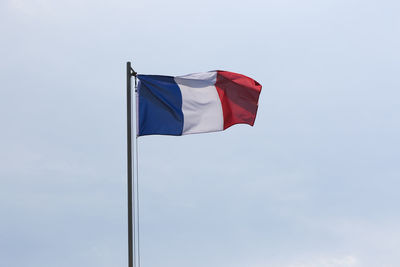 Low angle view of flag against clear sky