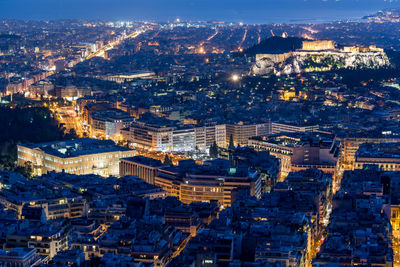 High angle view of illuminated cityscape at night