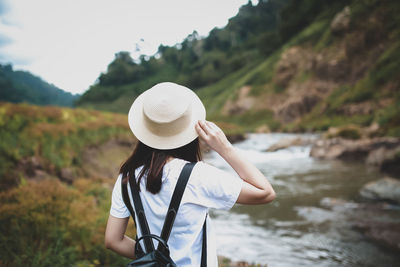 Rear view of woman wearing hat