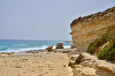 Scenic view of beach against clear sky