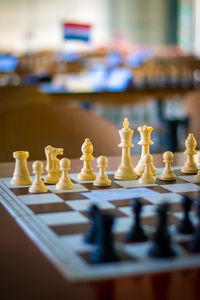 Close-up of chess board on table