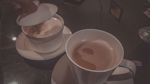 High angle view of coffee cup on table