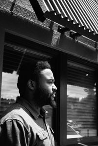 Close-up of thoughtful man in city