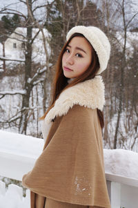 Young woman wearing warm clothes in winter