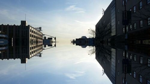 Buildings against cloudy sky