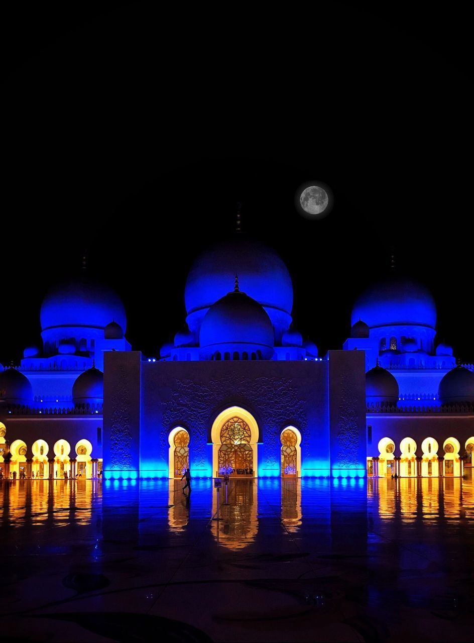 REFLECTION OF ILLUMINATED BUILDINGS IN WATER