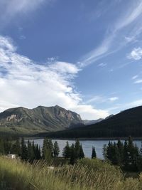 Scenic view of lake and mountains against sky