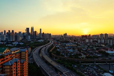 High angle view of city at sunset