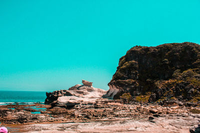 Scenic view of sea against clear blue sky