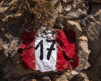 High angle view of text on rock