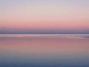 Scenic view of sea against sky at sunset