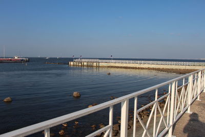 Pier over sea against sky