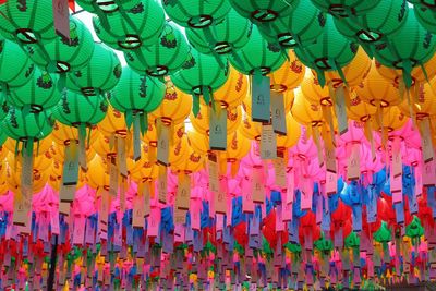 Multi colored lanterns hanging in row