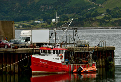 Fishing boats moored at harbor